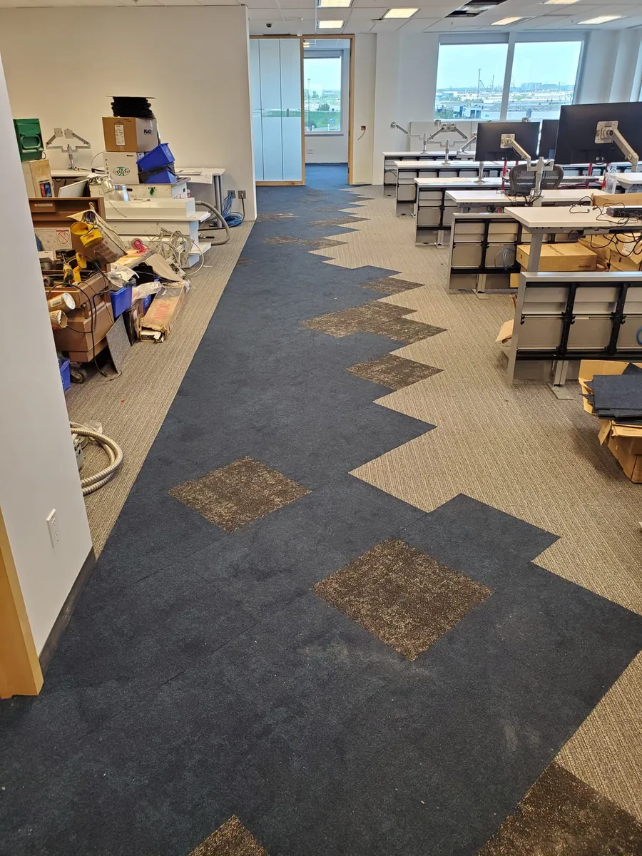 Modular carpet-tile installation in a commercial office by Geometrix Flooring & Design